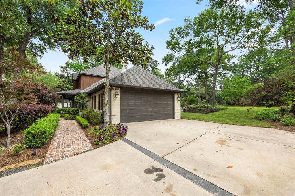 Spacious 2-car garage with 1 bay roll up door on the backside. Access pool accessories and toys easily without having to walk around, conceal all the fun stuff on the backside.  Welcome home and enjoy this amazing location just a few miles from the Clubs at Houston Oaks, Cypress, Tomball and an easy commute to the Woodlands and Houston.