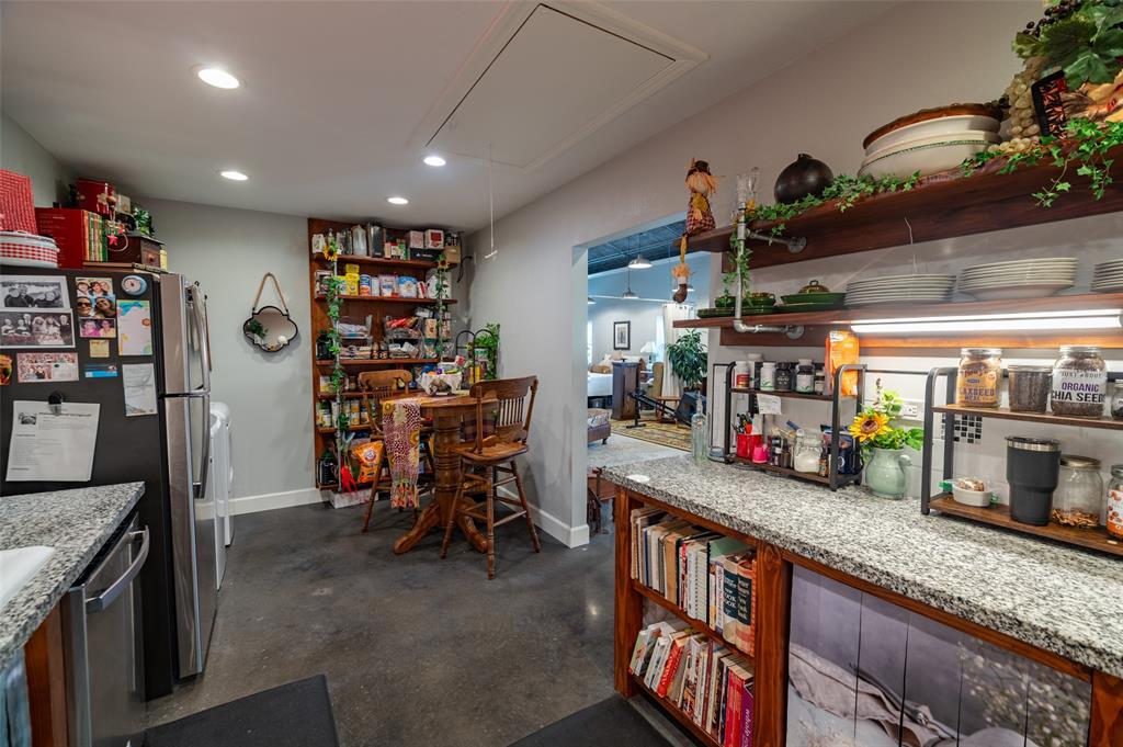 1610 N. Park St kitchen has a wide opening to the family room and rest of the space.  Only the bath and the kitchen have built in walls! The rest is up to your imagination!