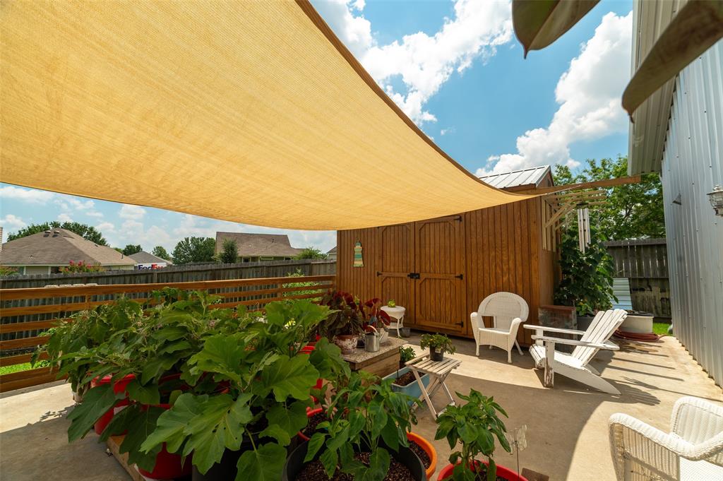 1610 N. Park St patio also includes this large sturdy shed with an 8 ft ceiling.