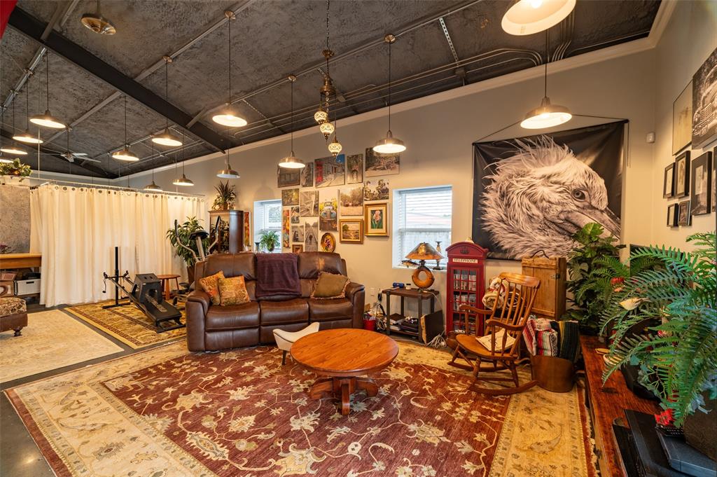 1610 N. Park St Living area is open to the rest of the home with pendant vintage lighting and open concept ceiling.