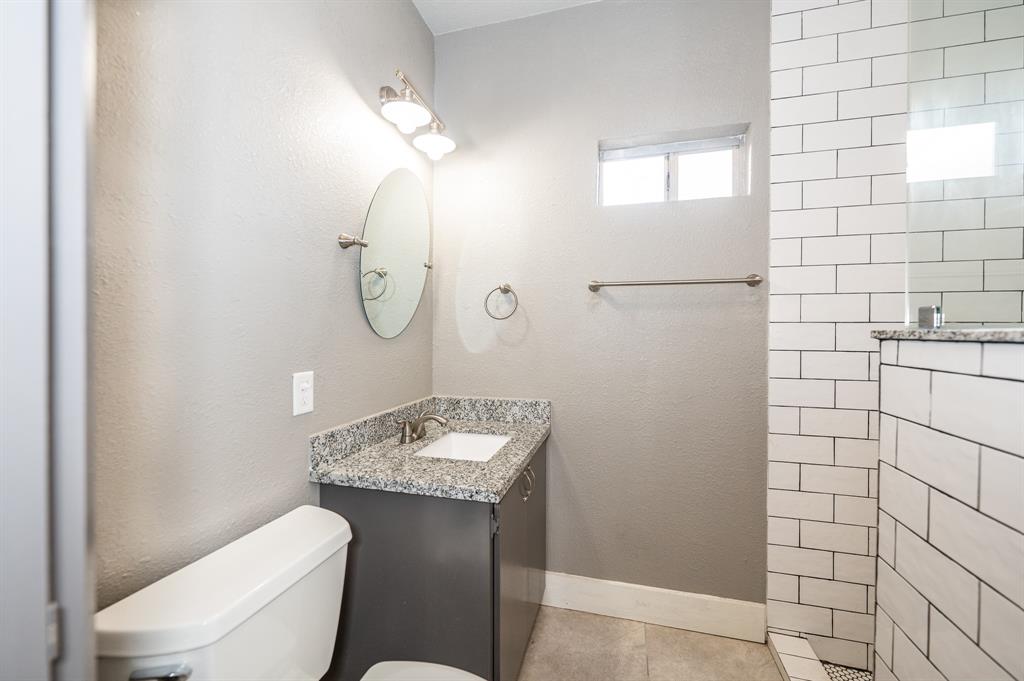 Bathroom with tiled shower