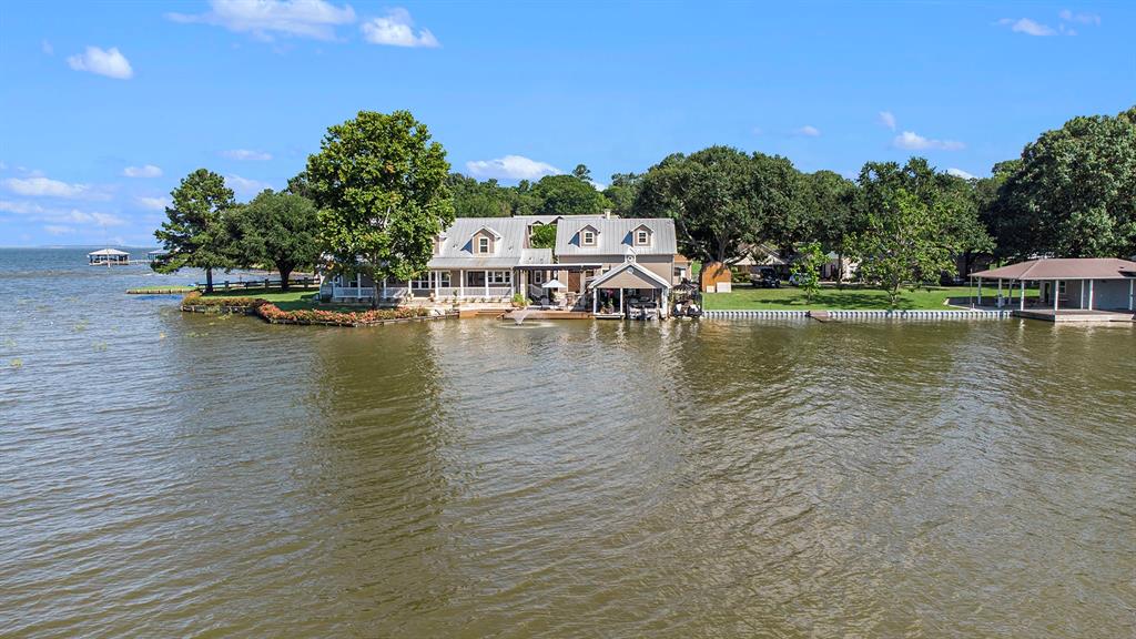 Back of the home with open water