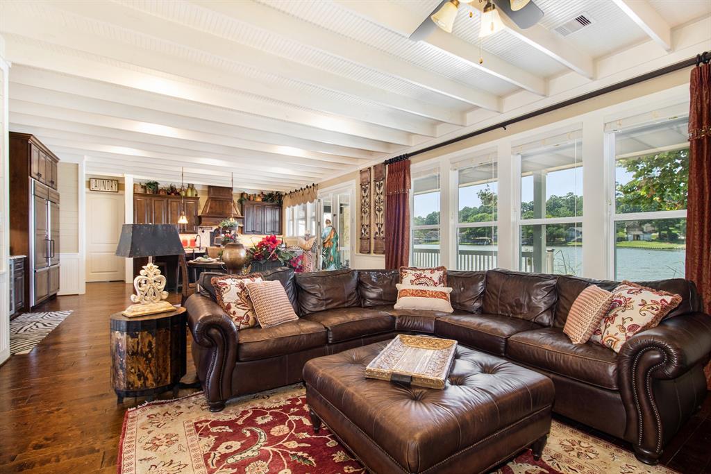 Living Room Open to Kitchen with Windows along the full back of the home with Beautiful Water Views