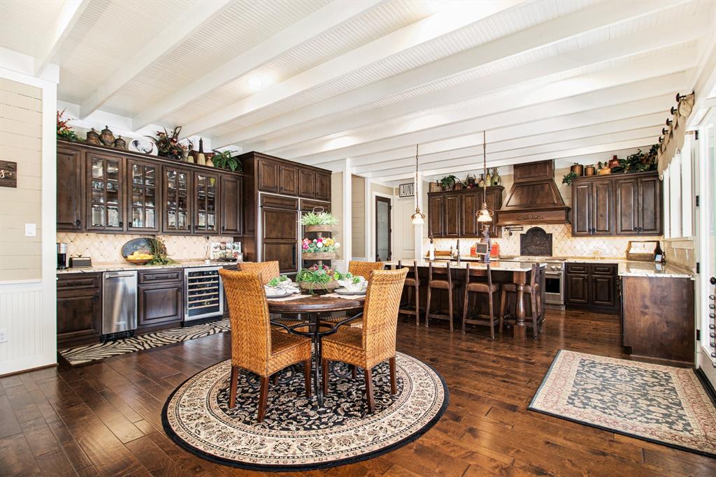 Kitchen with lots of windows and high end appliances