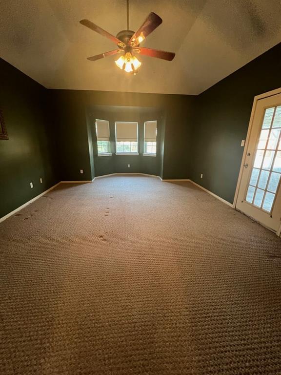 Large master bedroom with door to pool and patio