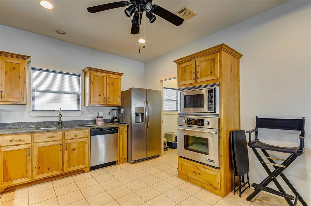 KITCHEN ALSO FEAUTURES RECENT SINK FAUCET, A DACOR MICROWAVE, STAINLESS APPLIANCES, JENN-AIR WALL OVEN AND PLENTY OF NATURAL LIGHT!