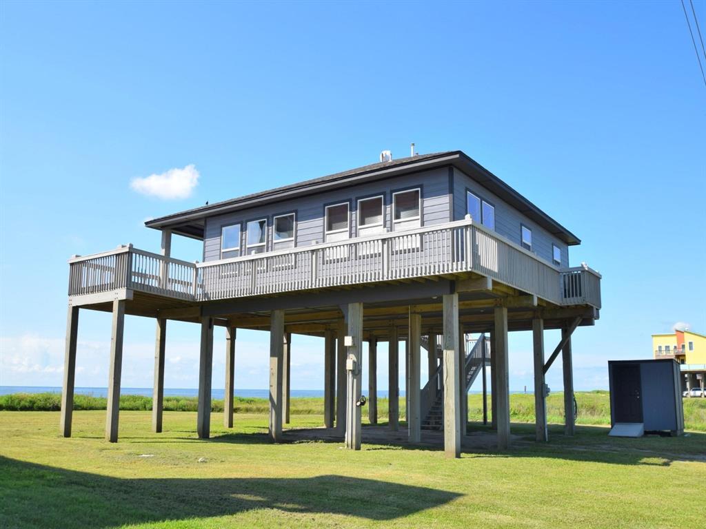 . The builder utilized every space in the home adding a large owners or storage closet underneath the stairs. The complete wrap around deck allows for easy maintenance. Enjoy your coffee on the south facing deck while watching the sunrise. The downstairs offers tons of room to entertain, BBQs, crawfish boils, sand shower & endless possibilities.