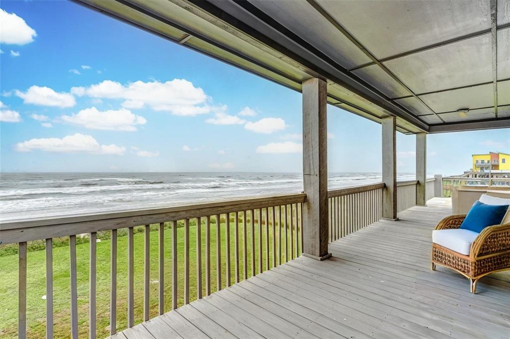 Large front porch which wraps around the entire house with amazing views of the beach and waves!