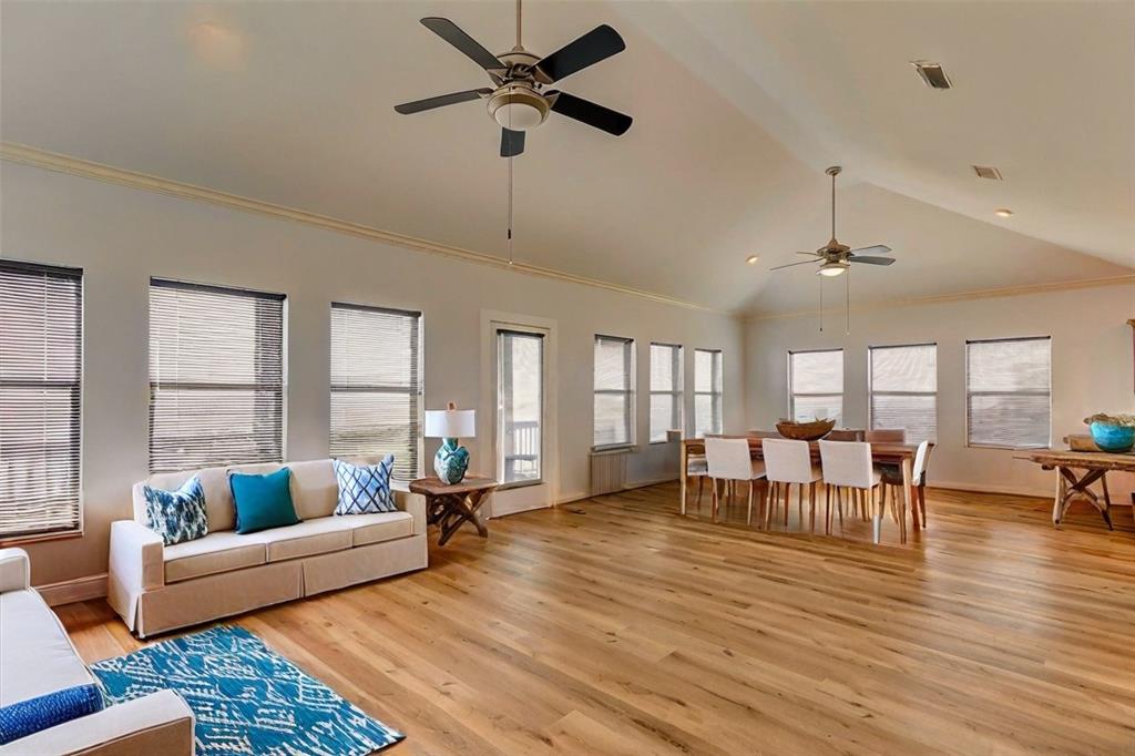 Decorating opportunities abound with this large, open living area, filled with natural light, new flooring, and beach views from every room in the home!