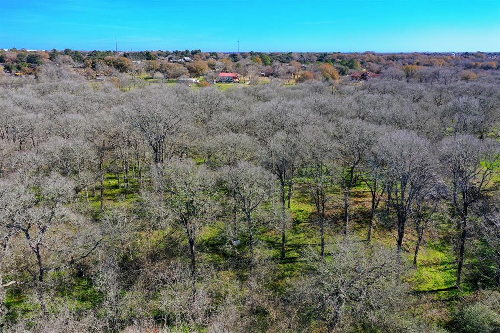 This wooded lot features fencing on both sides of the property.