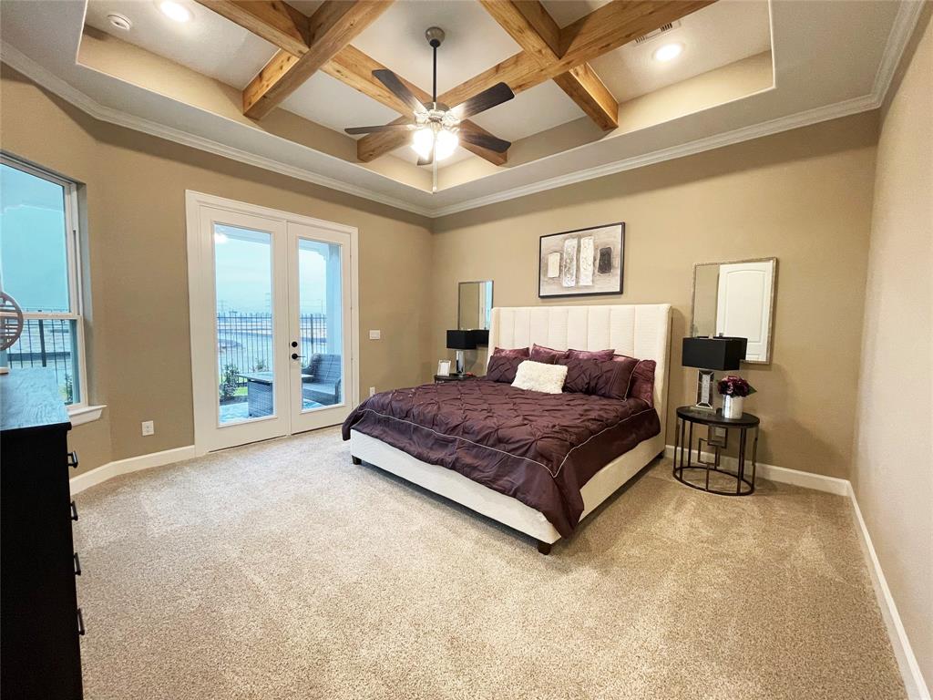 Discover the epitome of luxury and tranquility in the Portico\'s primary bedroom at Winfrey Estates. This elegant retreat features spacious interiors, exquisite finishes, and a serene ambiance, providing the perfect sanctuary for rest and relaxation. *Image depicts similar floorplan in the community.