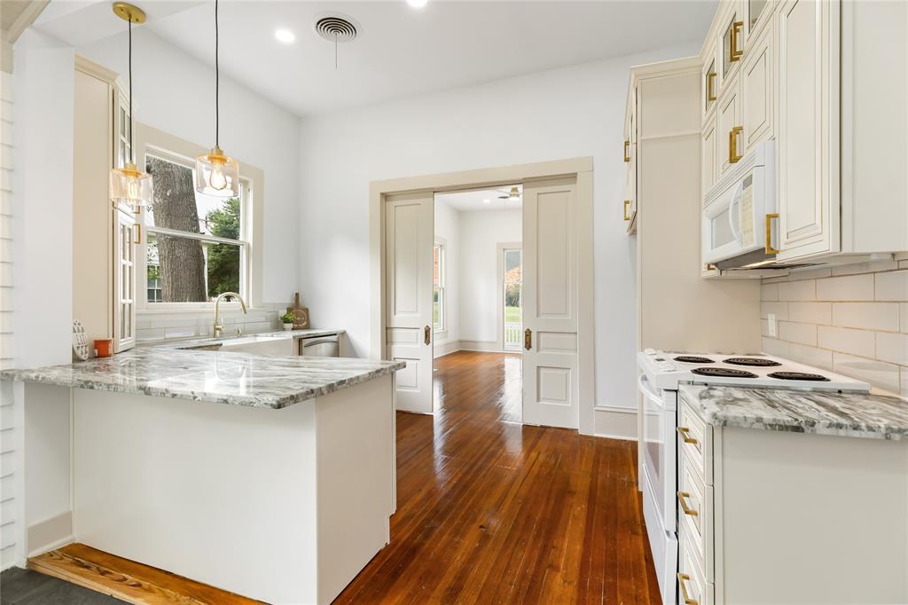 Another view of kitchen looking into the front living area