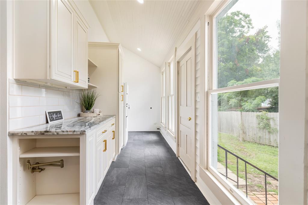 Laundry area and coffee bar new to the home. Washer & dryer moved from basement to upstairs