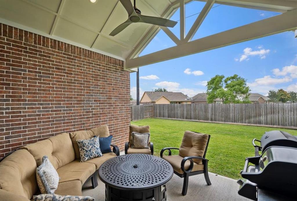 Vaulted Ceiling and added ceiling fan makes this patio perfect