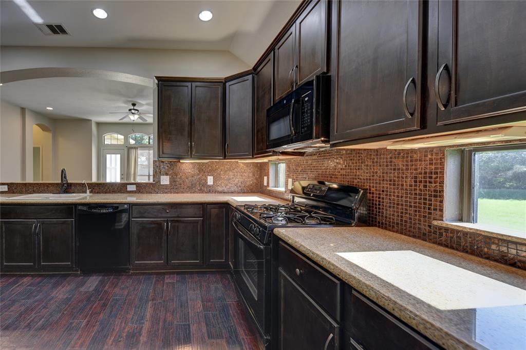 Ample countertops with side windows adding extra natural light to the space