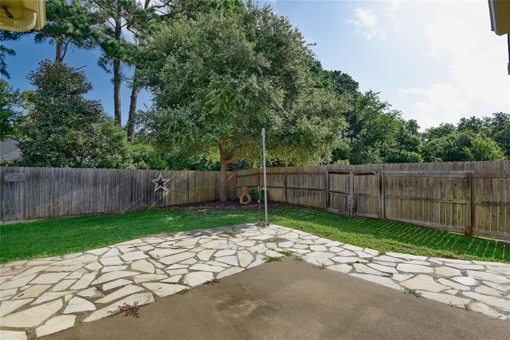 Extended stone patio and very private back yard