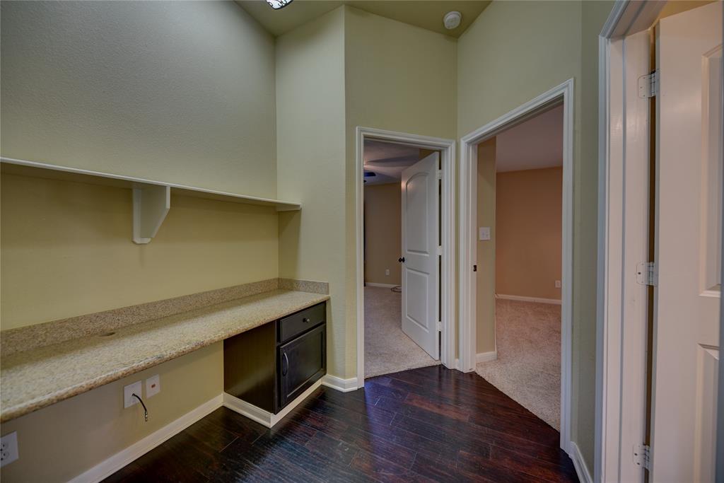 Built in desk and cabinetry makes excellent use of hallway space