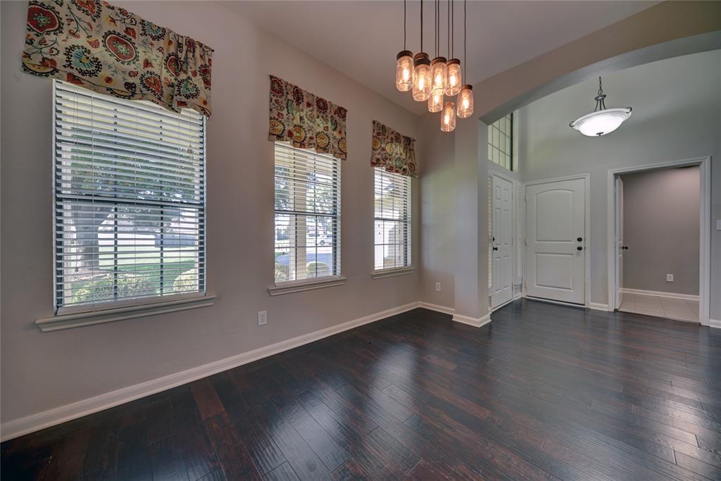 Floors are engineered wood throughout living areas and primary bedroom