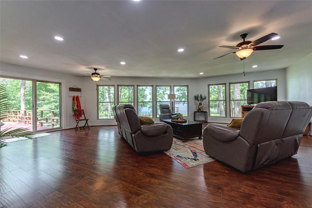 Huge living room leads right out to the wood deck