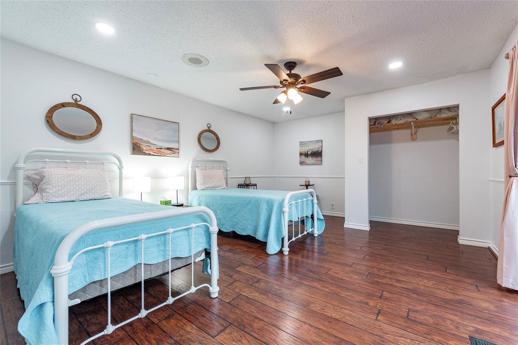 guest bedroom 2 was recently added and has glass doors leading outside to the deck area