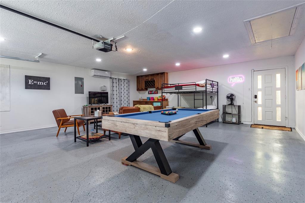 2 car garage with its own ac and heat has been converted to a game room but could easily be changed back