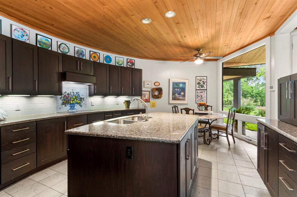 Abundant granite counter space to host and serve large gatherings. Tons of cabinets and drawers to store all your culinary tools.