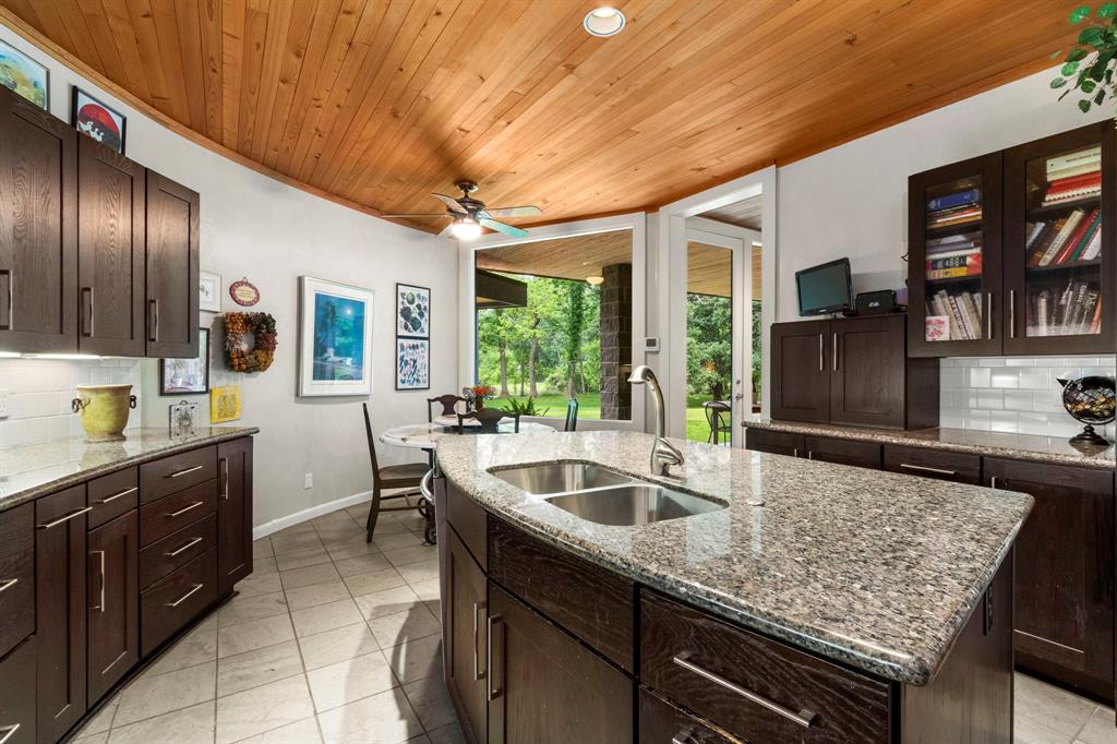 The kitchen is the heart of the home and centrally located to the dining and living areas. The large windows allow natural light to steam into this beautiful space. Note:additional storage space on both sides of the island.