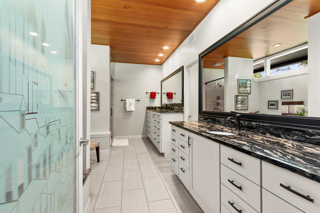 No detail was spared in the design of this spacious and luxurious primary bath. Separate dressing areas, a sitting area and huge walk in closet.