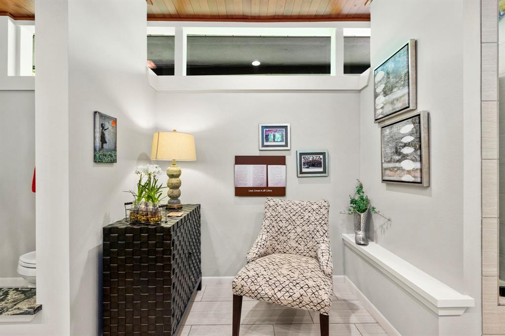 The bathtub was replaced with a sitting area. Should you prefer a soaking or jetted tub, the plumbing is in place.