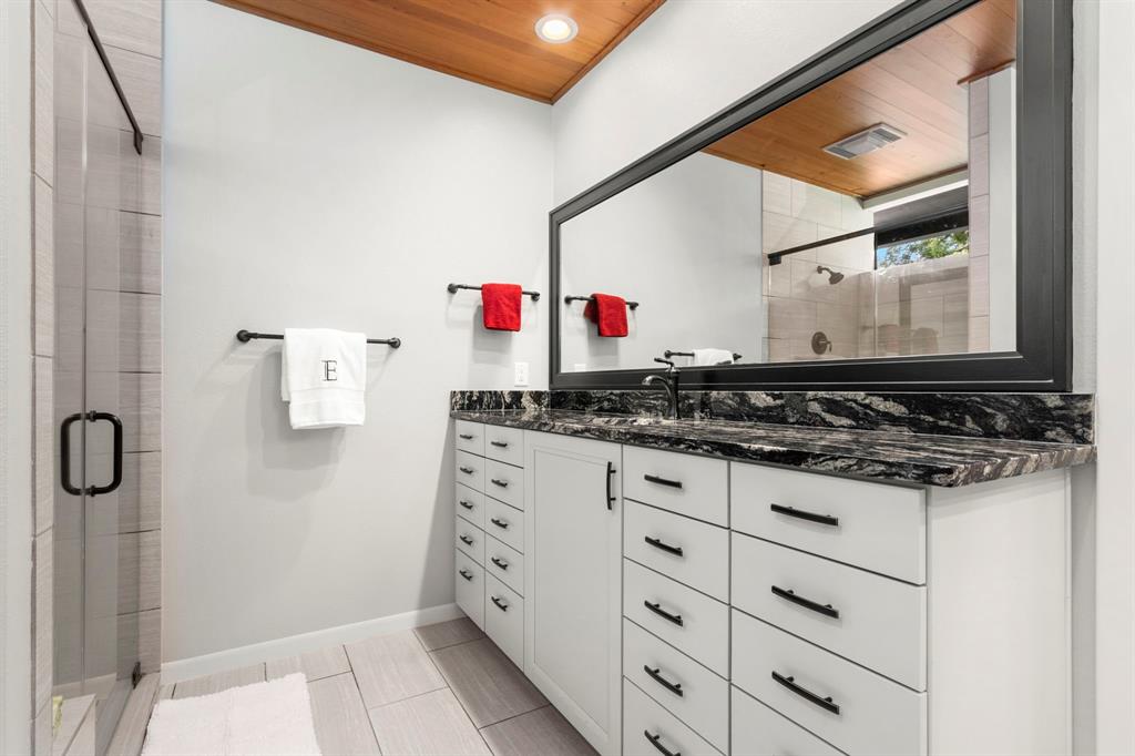 A closer view of one of the dressing areas reflects the amount of drawers and cabinets.