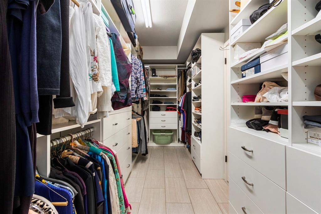 Large custom closet with built ins will accommodate all your wardrobe needs.