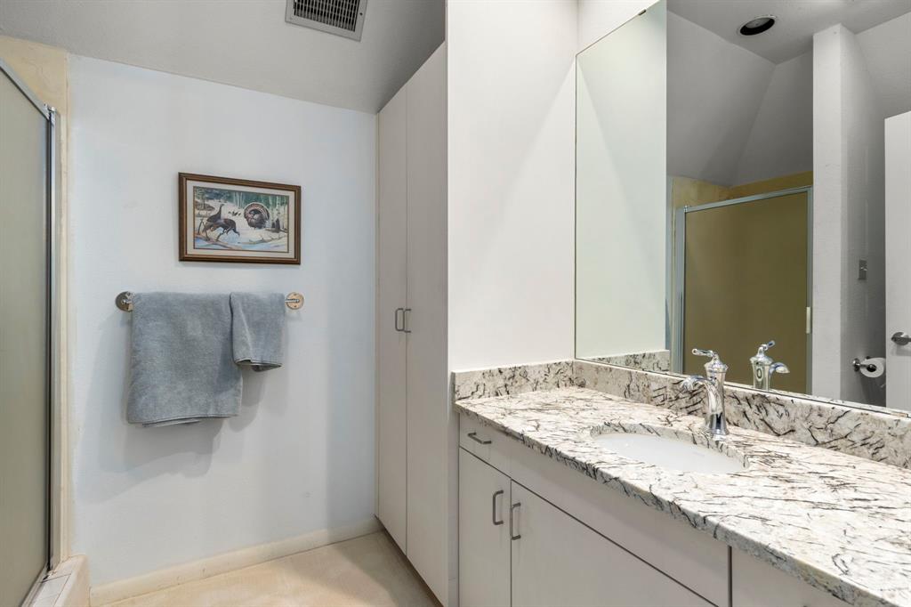 Second en-suite bath with large walk in shower. All bathrooms have been beautifully updated. A total of 3.5 baths in this luxury home.