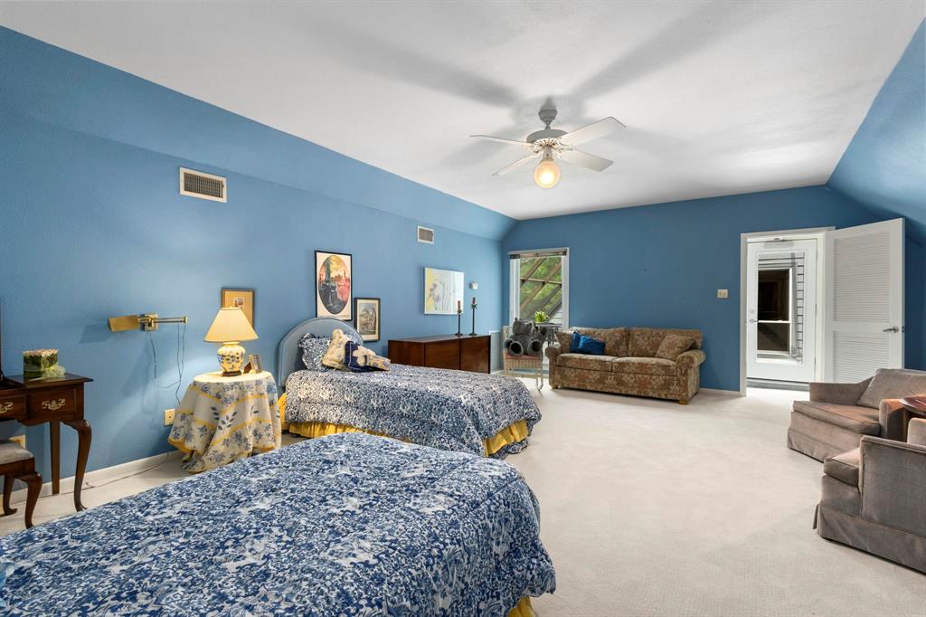 Another view of the third bedroom. The french door across the hallway leads to the large screened porch.