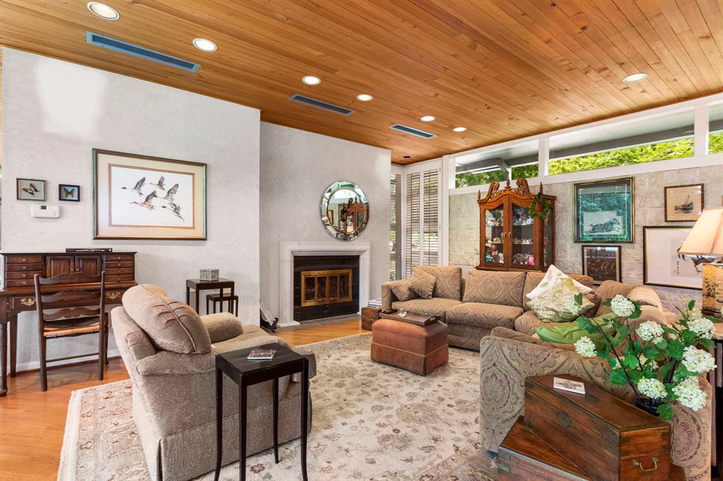 A closer view of the living area with the cypress ceiling throughout the first floor. You will love spending time in this great space.