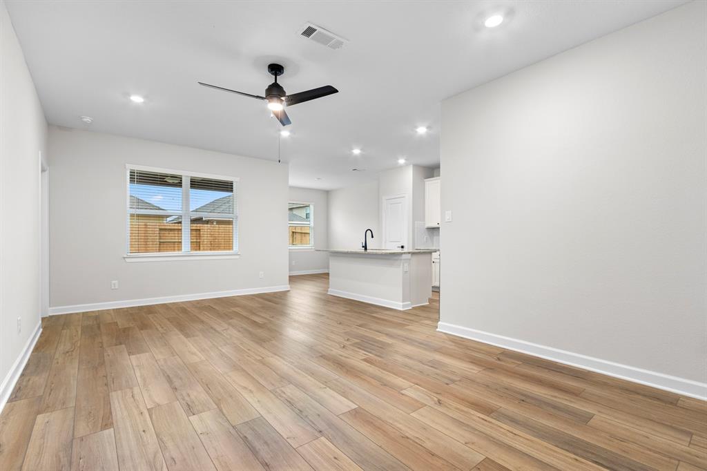 Kitchen with upgraded Whirlpool appliances and granite countertops.