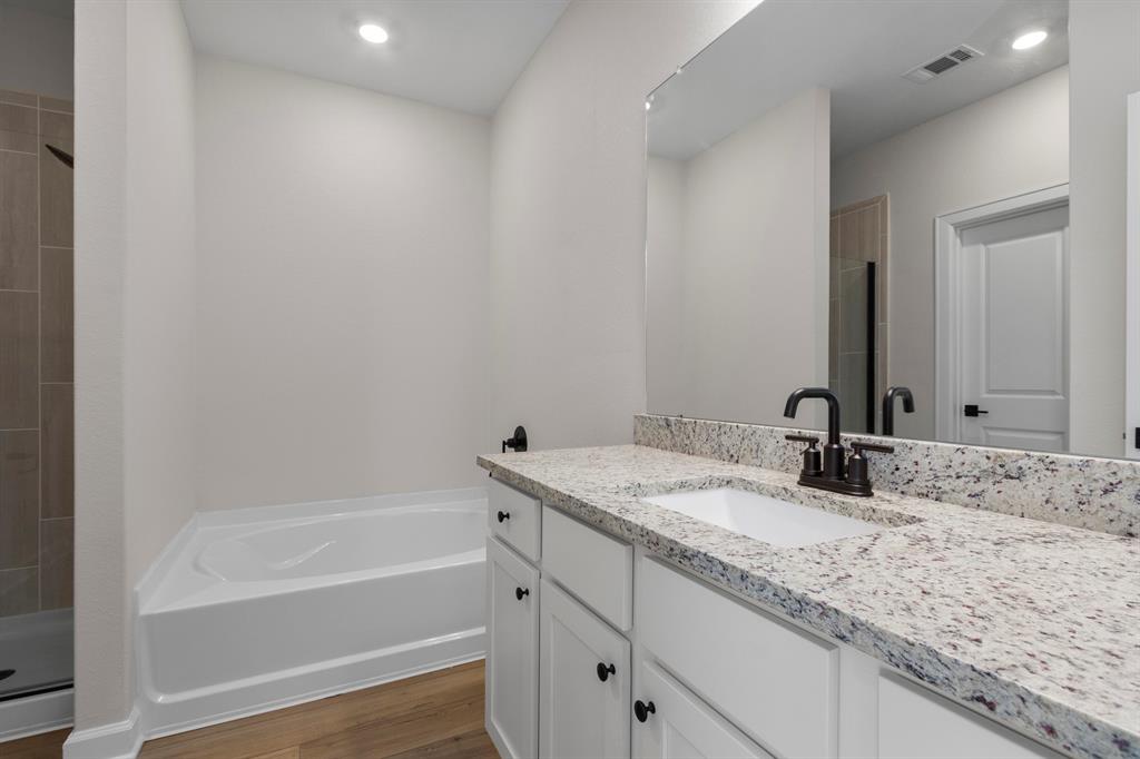 the Luxurious soaking tub and standing shower in the primary bathroom.