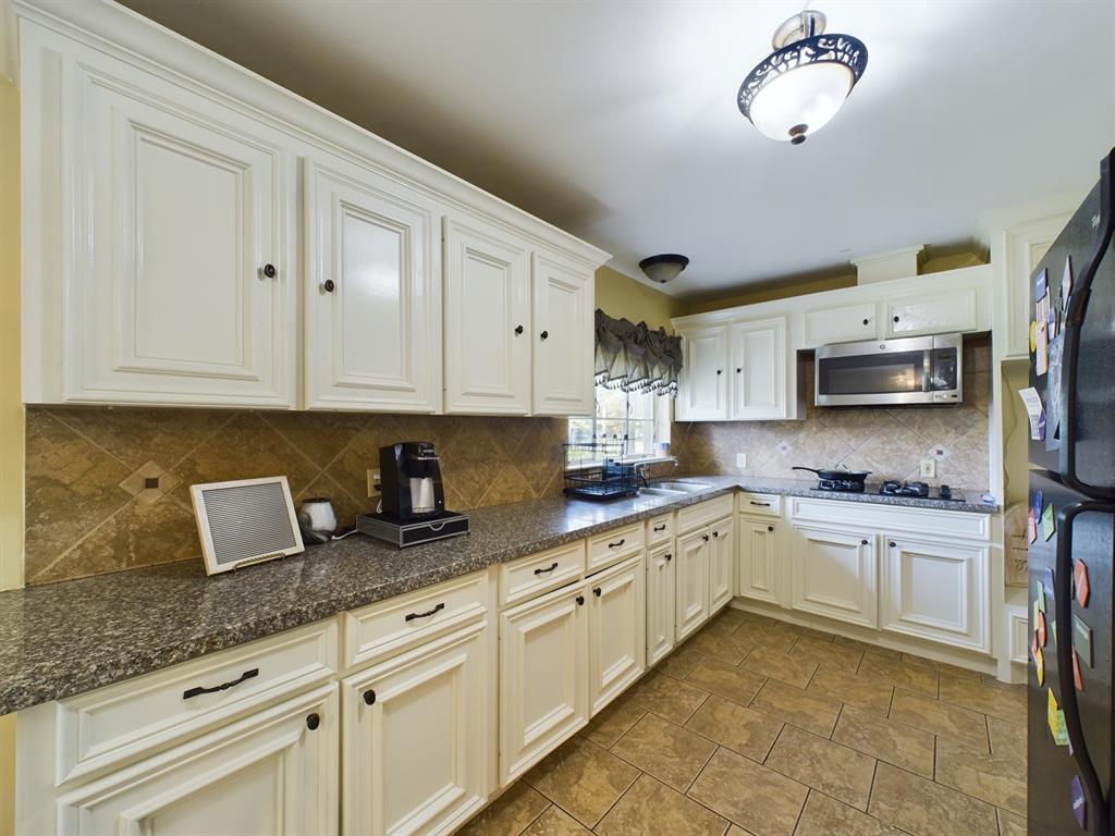 Solid Cabinetry, Granite Counters & Tile Backsplash