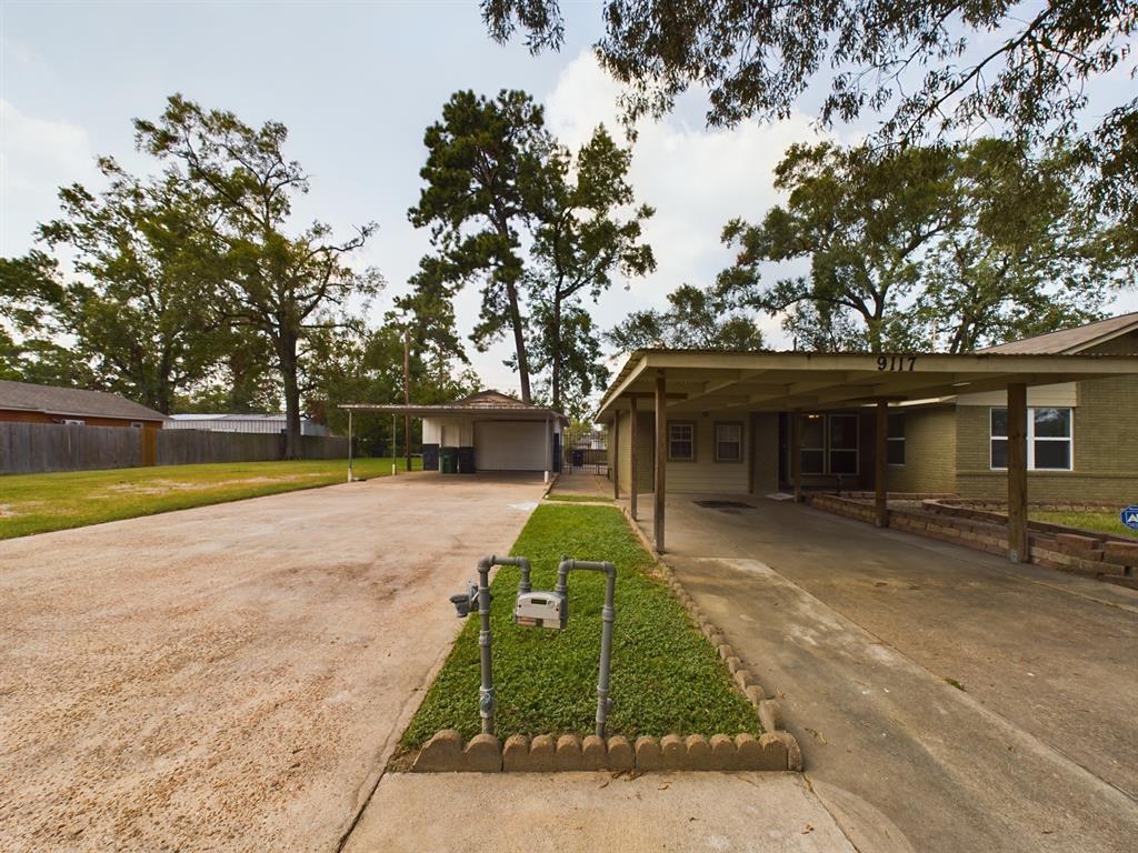 Detached Garage w/Double Wide Parking and Two Car Carport