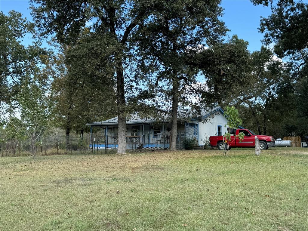 Looking for a little piece of land in the country this is it great place for weekends or everyday living plenty of 
   room to garden, located only 
  minutes from Lake Livingston and Trinity River, bring your family, make your appointment today and take a look