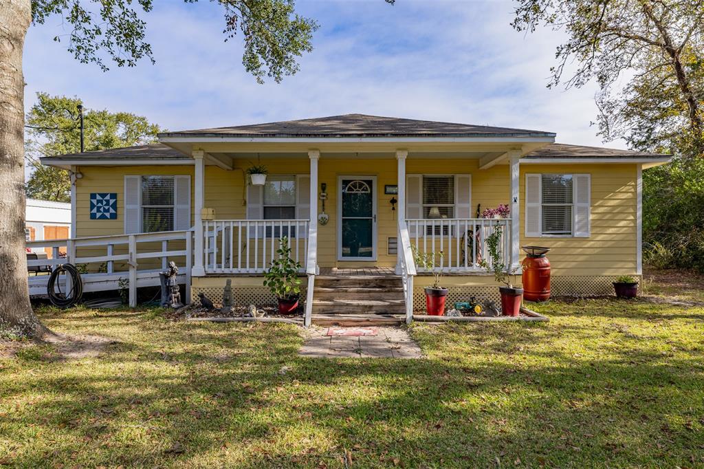 Tucked on a quiet country road, this charming 3-bedroom, 2-bath home sits on ~1.5 unrestricted acres, offering endless possibilities for peaceful living. Enter through a gated entry, leading to a serene landscape with a spacious storage building and a sizeable chicken coop, perfect for those dreaming of a country lifestyle. Thoughtfully designed with wheelchair ramps at the front and back doors, this home is accessible for all. Natural light fills the space, inviting warmth and comfort throughout. Enjoy mornings on the porch, savoring the sounds of nature or exploring the land, where tranquility meets opportunity. Located just minutes from Bellville's charming downtown and a short drive to Brenham, you’ll have the best of both quiet country living and nearby conveniences. Whether it’s a cozy homestead or a personal retreat, this property is ready for you to make it your own.