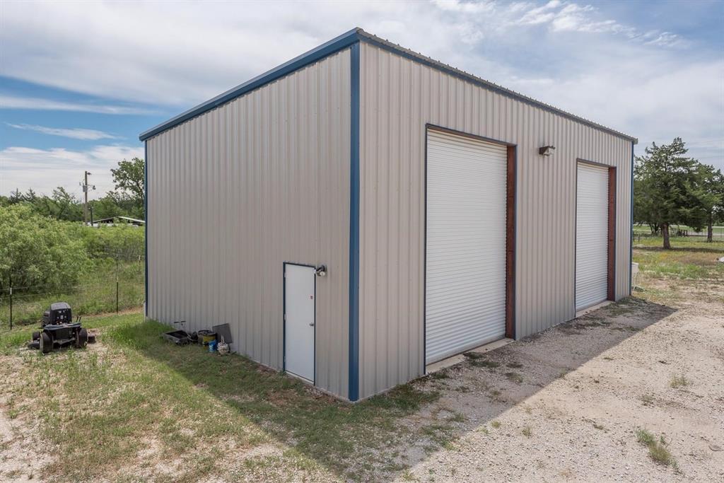 Prime Property with Excellent I-45 Frontage! Unlock endless potential on approximately six acres, perfectly positioned with remarkable frontage along I-45. This property is thoughtfully equipped with a spacious metal shop, and multiple RV hook-ups, all set against a broad expanse of fenced-in land, creating a versatile foundation for unlimited possibilities. Built with quality and convenience in mind, the metal building provides a solid workspace, while a large gravel yard offers easy access and additional possibilities. Don’t miss this exceptional opportunity to bring your plans to life in a high-visibility location!