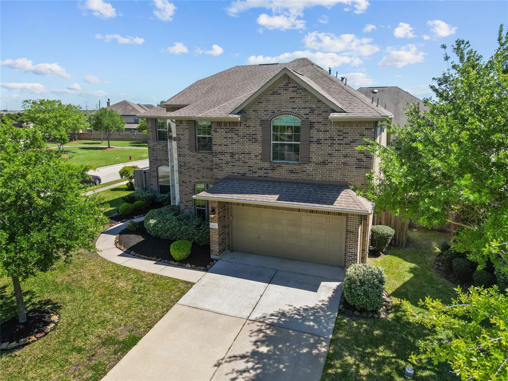 Talk about move-in ready! This home has been updated inside and out! From the sophisticated new look of the office/study, to the intricately designed dining room ceiling, this home is built to impress. 19' ceilings, panoramic outdoor views, a decked-out kitchen, and an incredible wine room. Upstairs, there's a big game room that could easily convert to a 5th bedroom. The media room is dramatic. The backyard is equipped with a full kitchen and new gas grill.   A/Cs, heater, tankless water heater, and attic insulation were installed in 2021. All carpet replaced 2024. Home painted inside and out 2024. Great neighbors! Great location! Check out the community pool, playground, splashpad, miles of walking trails, catch-and-release fishing, and fun community events!