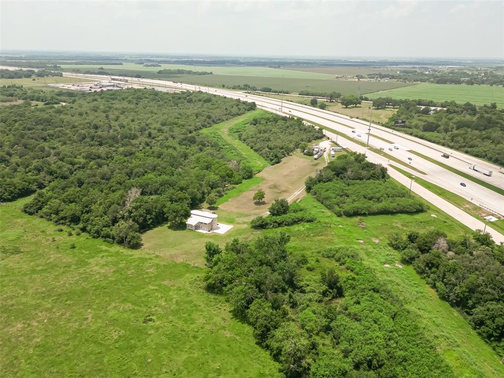 Versatile home/office on 3+ acres on feeder road of the Southwest Fwy.PRIME location in fast growing area w/new development!Easy access to on ramp,6 minutes from the Fort Bend Epicenter & 10 minutes to Highway 36/Fort Bend County Fair Grounds.Building sits at the back of the 3+ acres & has multiple uses.Building would make a great home & build in front or use building for an office & home.Newly completed construction has been well designed w/designer touches.1st floor w/multiple doors,large windows, stunning kitchen & what could be dining/living, office or waiting room.Two bedrooms on 1st floor could also be used for individual private offices w/large bath,walk-in shower w/dual shower heads.Upstairs loft would make a fabulous primary retreat or additional living/office space.Primary bath w/Kolher bubble jetted tub & double sinks.There are 2 12x8 bonus rooms off of the primary which could be walk-in closets,storage or make for additional home office space.Land is UNRESTRICTED!