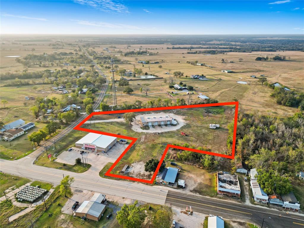 This prime 5.37-acre property is strategically located at the bustling intersection of OSR and Hwy 21, offering unmatched visibility in a high-traffic area. The 7,000-square-foot versatile workshop features six roll-up doors, providing excellent functionality for a wide range of operational needs. Its proximity to a thriving industrial district, leading logistics centers, and key transportation routes ensures seamless connectivity and access. With ample storage space and potential for customization, this property is well-suited for a truck stop, industrial, warehouse, or distribution endeavors. Situated in a rapidly growing sector, this location offers outstanding opportunities for development or expansion. Don’t miss this incredible opportunity—schedule your private tour today!