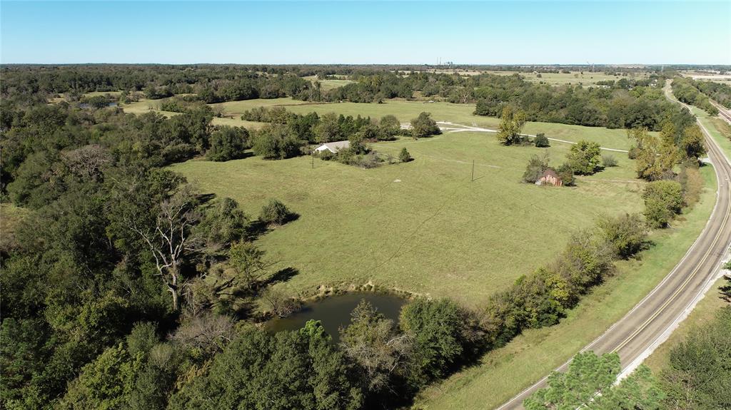 This is what you've been waiting for! This premium new listing is a custom brick home, in need of some TLC, on 55.43 +/- acres located off FM 1512 in Jewett. What a stunner this could be! Call us today for an appointment to see this 4-bedroom 2.5 bath home on rolling acreage. It has front and back porches, a massive open concept kitchen and dining, and a primary suite with a French door to the backyard. The property itself features not one, not two, but THREE ponds! Such a beautiful mix of pastures, woods, and views! The landscape can't be beat. Make this your future!