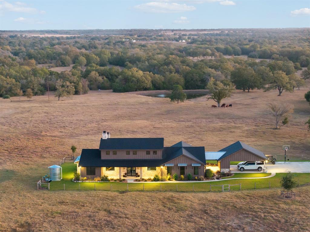 Discover the ultimate blend of comfort, recreation, and rural charm on this expansive 80-acre property in Burleson County, just minutes from Lake Somerville. Anchored by a beautiful 2023 custom-built home, this 2,979-square-foot residence features 3 bedrooms, 2.5 baths, and a spacious loft, offering modern luxury and timeless appeal. The property also includes a 30x45 metal barn with a concrete foundation, a water well, cattle pens, and two tanks, making it ideal for a variety of agricultural and recreational uses.

Nature enthusiasts and hunters will appreciate the exceptional hunting potential, with Birch Creek running along the northern boundary and feeding into Lake Somerville. The diverse landscape supports abundant wildlife and offers opportunities for fishing, grazing, or outdoor adventures. 

Whether you're looking for a permanent residence, a recreational getaway, or a working ranch, this property is a rare find with unlimited potential.