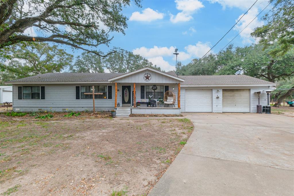 This charming property on 3 acres located in Tidehaven ISD school district features a spacious double-wide home with a two-car attached garage. All kitchen appliances and septic system have recently been replaced. Outside, you'll find a new barn on a slab, a shed in the backyard for more storage, a chicken coop and an RV cover over a concrete slab—perfect for all your outdoor needs and hobbies.