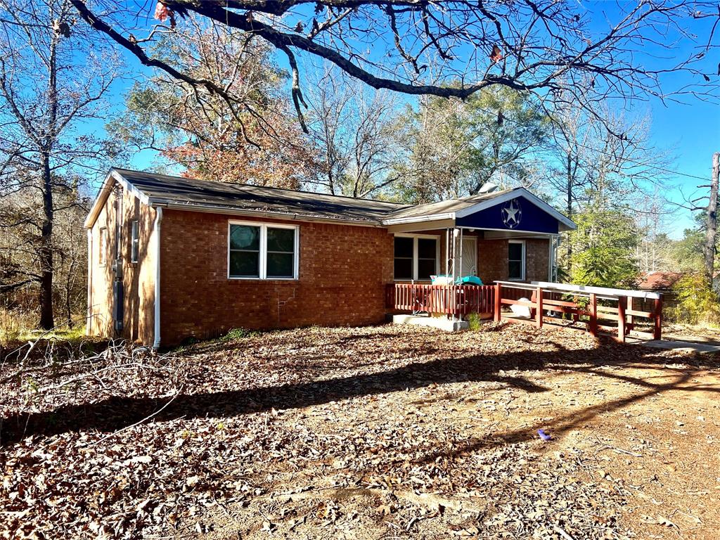 Well maintained 3BR, 1.5 Bath home on 17.8 acres adjacent to Davy Crockett National Forest!. The home has new windows, updated kitchen appliances, and replaced plumbing lines with pex pipe. There is an updated survey in place. There is also new fencing installed around the back yard of the house. The land features a wet weather creek, a pond, and scattered pines and hardwoods. Excellent hunting opportunities!