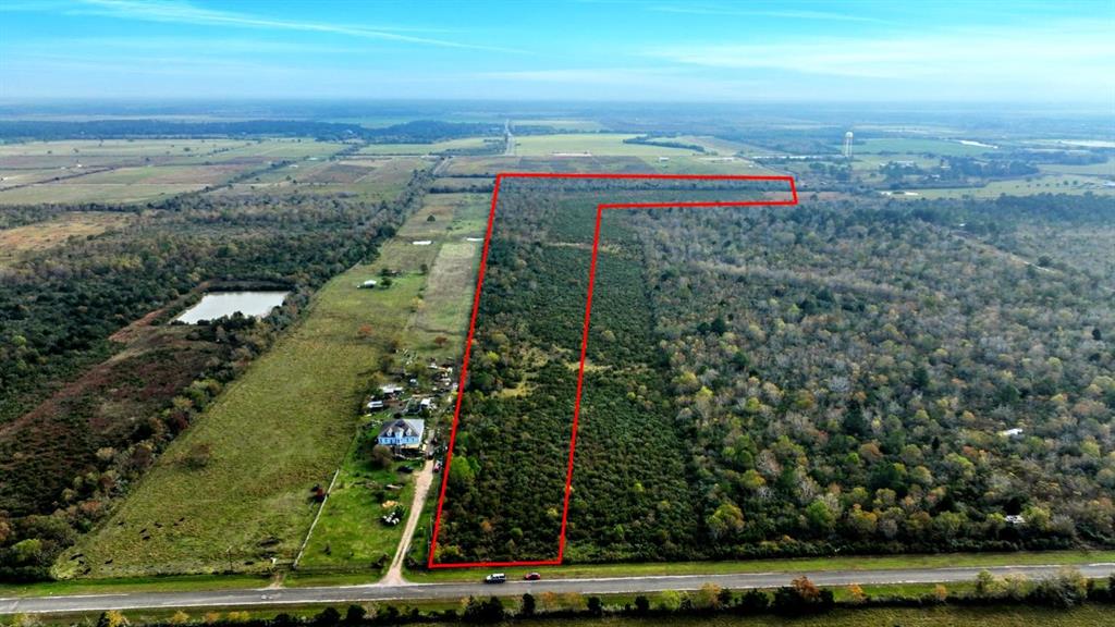 Searching for a spacious retreat just outside city limits, yet conveniently close to I-10 for easy commuting to Beaumont or Houston? This is the solution! Turn this spacious 43-acre property into your personal dream haven or fishing lodge with room for housing multiple customers providing the ultimate multi-day full fishing lodge experience to the Trinity Bay less than 2 minutes (just 1.4 miles) drive to waterfront parks and public access to Trinity Bay and Double Bayou with public boat ramps, fish cleaning stations and boat slips. Enjoy the local cuisine and entertainment at the Channel Marker, Oak Island Lodge, Yacht Club, and a winery with a walk-up bar! The cities of Anahuac and Mont Belvieu are just short drives away with more diverse shopping, dining, and play experiences. Arrive before sunset and stay until dark to watch the sun kiss Trinity Bay!  *** SELLER IS OPEN TO SUBDIVIDING OR CAN BE SUBDIVIDED BY THE BUYER FOR SMALL DEVELOPMENT PLANS***