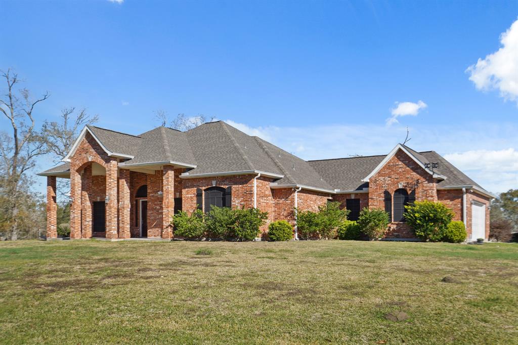 Stunning one story ranch home on 30 acres in Crosby built with consideration  in mind.  It is fully accessible.  Formal living and dining. The grand kitchen is open to the living area.  High ceilings with crown molding.   It comes with a full home generator, solar panels, barns, pond, cross fencing, gated entry and circle driveway.   Oversized garage.  Tile flooring throughout with exception to the bedrooms that have carpet.